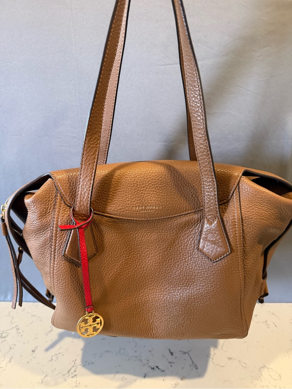 Tory Burch Tan Pebbled Leather Shoulder Bag with Red Charm